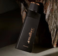 Malbec Black EDT flacon noir appuyé contre un arbre 100ml